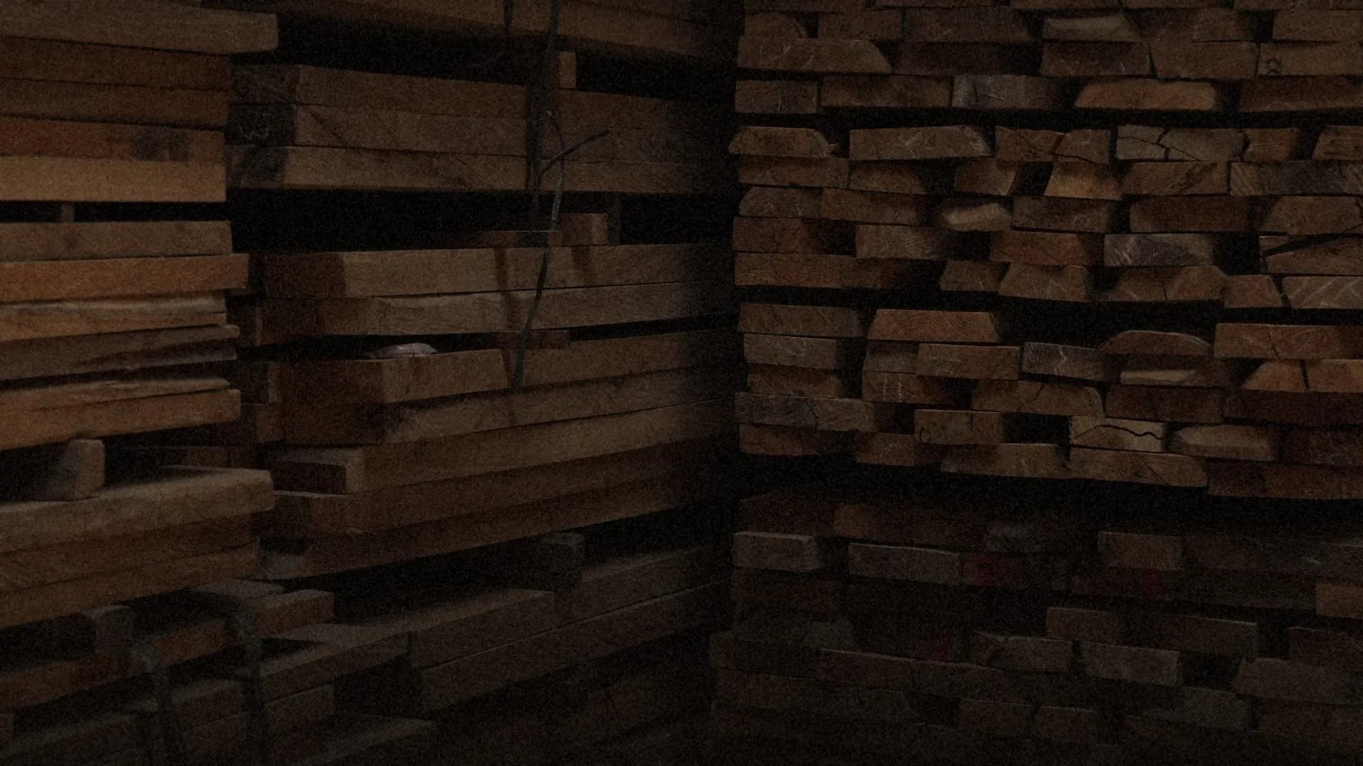 Seasoned timber stacked at a partner yard